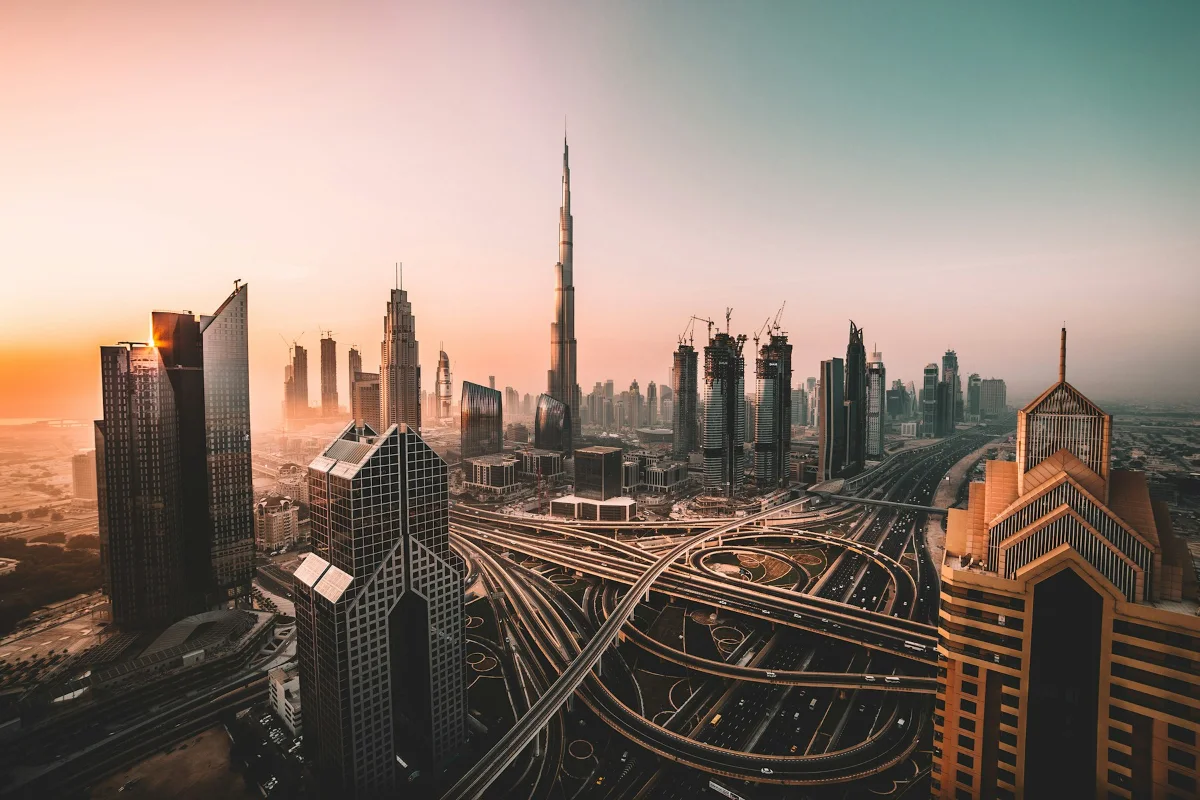 Dubai skyline at sunset, with Sheikh Zayed Road interchanges below the Burj Khalifa